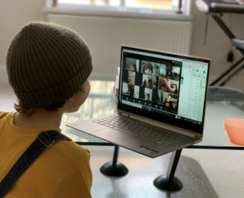 Young student on a Zoom call with other students learning from home