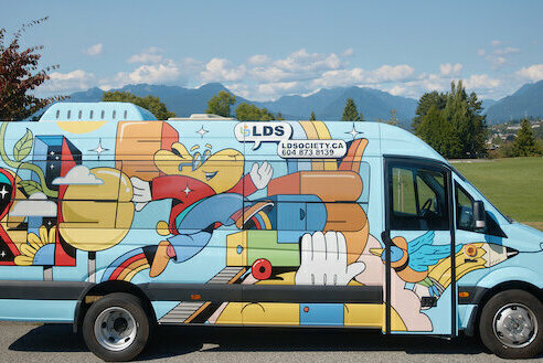 LDS mobile classroom van covered in creative graphics