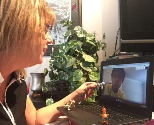 Teacher virtually teaching a student online
