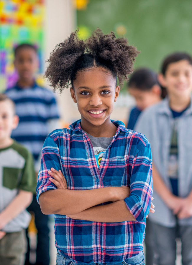 https://lightwelllearning.ca/wp-content/uploads/2022/12/girl-in-class-with-confidence.png