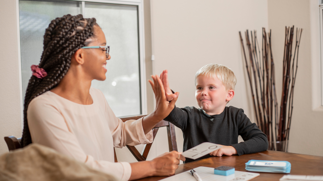 https://lightwelllearning.ca/wp-content/uploads/2023/03/Teacher-and-high-five.png