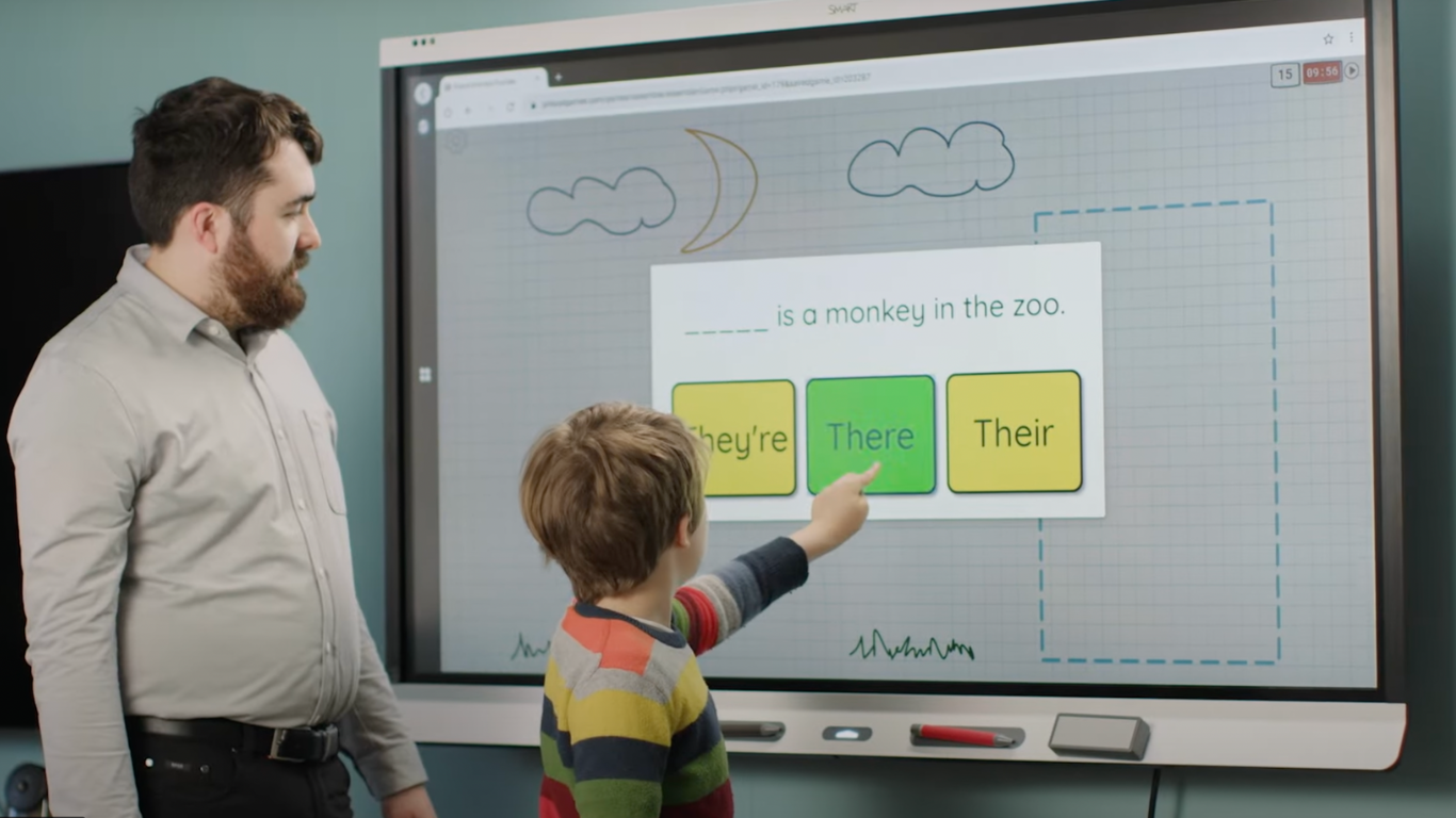https://lightwelllearning.ca/wp-content/uploads/2023/10/Child-spelling-on-smartboard.png