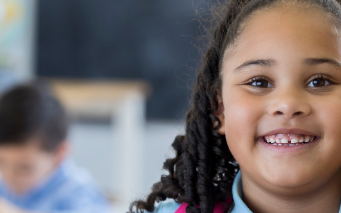 Child smiling and confident