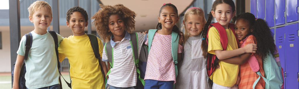 Row of kids at school with arms around each other