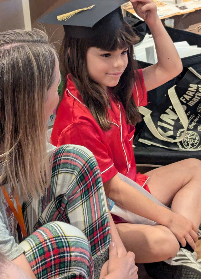 https://lightwelllearning.ca/wp-content/uploads/2024/08/Girl-with-instructor-and-grad-hat.png