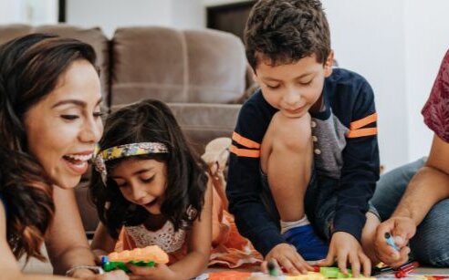 family playing together on floor