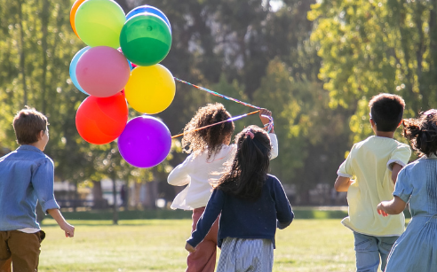 kids in park with balloons