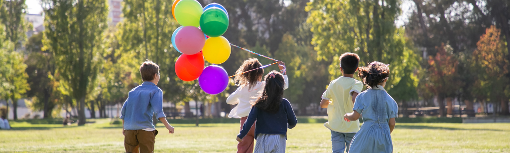 kids in park with balloons