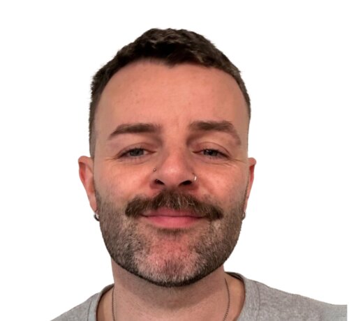Man with moustache looking at camera