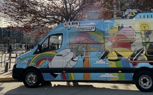 colourful mobile classroom parked on street